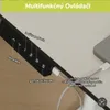 A close-up of a multifunctional controller for a desk, with text labels and a phone charging. Náhľad obrázku produktu
