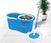A blue spin mop bucket and mop are displayed on a tiled floor with a potted plant in the background. Podgląd zdjęcia produktu