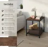 A side table in a living room setting, with text highlighting its features. Náhled obrázku produktu