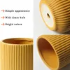 Collage of images showing a yellow ceramic planter with a ribbed texture, highlighting its features. Produktbild-Vorschau