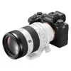 A Sony Alpha 1 camera with a white telephoto lens attached, shown against a white background. Produktbild-Vorschau