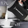 A hand pours water from a black electric kettle into a white teacup. Produktbild-Vorschau