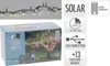 A box of solar-powered LED string lights with a picture of the lights on a tree. Produktbild-Vorschau
