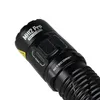 A close-up of the body of a black flashlight, showing the brand name and controls. Produktbild-Vorschau