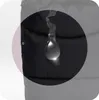 A close-up of a black fabric with a water droplet on it, highlighting its water-repellent properties. Náhled obrázku produktu