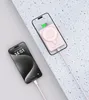 Two iPhones are shown, one charging with a cable and the other with a magnetic power bank attached. Náhled obrázku produktu