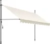 A cream-colored awning with a scalloped edge is extended from a black metal frame, supported by two vertical poles. A crank mechanism is visible on the left pole. Náhled obrázku produktu
