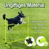 A dog jumping over an agility hurdle in a grassy field. Voir les images du produit