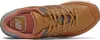 A top-down view of a New Balance 574 leather sneaker. Voir les images du produit