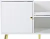 A close-up view of a white cabinet with a ribbed door and a gold handle, next to an open shelf with a white cushion. Gold legs are visible at the bottom. Anteprima dell’immagine prodotto