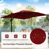 A red rectangular patio umbrella is set up on a balcony or patio area with a white railing and some greenery in the background. There are icons and text at the bottom highlighting product features. Náhled obrázku produktu