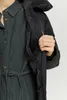 A person's hand is shown reaching into the inner pocket of a black jacket. Produktbild-Vorschau