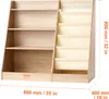 A wooden bookshelf with multiple shelves and fabric bins, with dimensions indicated. Náhled obrázku produktu