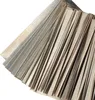 A close-up, angled view of a stack of thin, metallic strips, likely for battery connections. Produktbild-Vorschau
