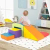 A baby playing on a colorful foam climbing set in a child's room. Produktbild-Vorschau