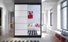 A modern hallway with a large wardrobe with mirrored doors reflecting a living room. Náhled obrázku produktu
