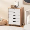 A roll container with five drawers is placed next to a sofa and a round ottoman. Náhľad obrázku produktu