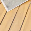 A close-up view of a wooden table with a magazine on it. Anteprima dell’immagine prodotto