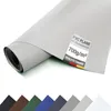 A rolled-up piece of light gray PVC tarpaulin is shown diagonally against a white background. A label with product information is affixed to the tarpaulin. Below the tarpaulin, a row of swatches in various colors are displayed. Voir les images du produit