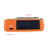 The image shows the side view of an orange emergency radio with a solar panel and a function switch. Voir les images du produit