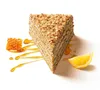 A slice of honey cake with honeycomb and an orange slice on a white background. Produktbild-Vorschau