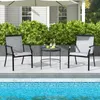 Two outdoor chairs and a small table are set up on a patio next to a swimming pool. Produktbild-Vorschau
