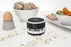 A mini desktop vacuum cleaner is shown on a white surface with food items in the background. Anteprima dell’immagine prodotto