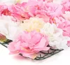 A close-up view of artificial flowers attached to a green grid. Podgląd zdjęcia produktu