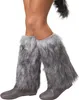 A person wearing fuzzy leg warmers and boots. Produktbild-Vorschau