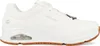 A white Skechers sneaker with a brown sole is shown from the side against a white background. Produktbild-Vorschau