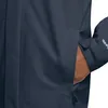 A close-up shot of a person's hand in the pocket of a navy blue jacket. Anteprima dell’immagine prodotto