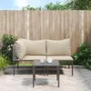 An outdoor patio setting with a lounge set and a small coffee table. Podgląd zdjęcia produktu
