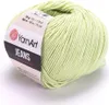 A ball of light green yarn on a white background. Podgląd zdjęcia produktu