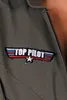 A close-up of a patch on a gray garment. Produktbild-Vorschau