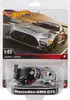 A Hot Wheels Mercedes-AMG GT3 toy car in its packaging, displayed against a blurred background of a race track. Náhľad obrázku produktu