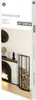 A product shot of a firewood rack next to a fireplace, with decorative items on a mantelpiece. Produktbild-Vorschau