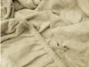 A close-up view of a beige terry cloth bedsheet, showing the texture and elasticized edge. Náhľad obrázku produktu