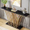 A modern console table with a black marble top and gold metal legs, decorated with a vase of greenery, a candle holder, books, and a bust sculpture. Produktbild-Vorschau