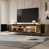 A modern living room with a wall-mounted TV cabinet and a large television. Podgląd zdjęcia produktu