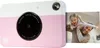 A pink and white Kodak instant print camera with a photo of a father and daughter emerging from the side. Podgląd zdjęcia produktu