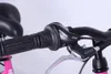 Close-up of a bicycle's handlebar, showing the grip, gear shifter, and brake lever. Produktbild-Vorschau