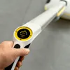 A hand holding a cleaning device with a digital display. Anteprima dell’immagine prodotto