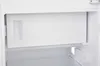 Inside of a white refrigerator, showing a pull-out drawer. Produktbild-Vorschau