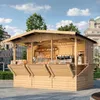 A wooden market stall selling baked goods and coffee, set up on a paved plaza with buildings and trees in the background. Produktbild-Vorschau
