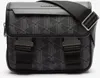 A studio shot of a black Lacoste messenger bag with a geometric pattern. Anteprima dell’immagine prodotto