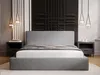 A modern bedroom with a gray upholstered bed as the central focus. Produktbild-Vorschau