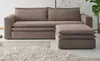 A brown corduroy sofa set with an ottoman is shown in a room with a fluffy rug. Produktbild-Vorschau