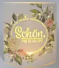 A decorative LED lantern with floral motifs and text. Produktbild-Vorschau
