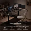 A modern home office setup with a black L-shaped standing desk, two monitors, a chair, and bookshelves. Produktbild-Vorschau