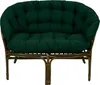 A green cushion set on a brown rattan sofa. Anteprima dell’immagine prodotto